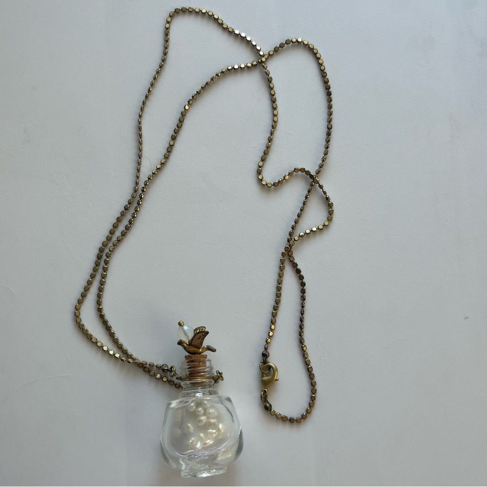 beautiful vintage-inspired necklace with bird and glass bottle charm pearl